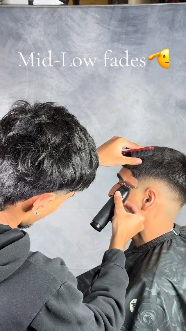 RD Cutz shaping a mid-low fade